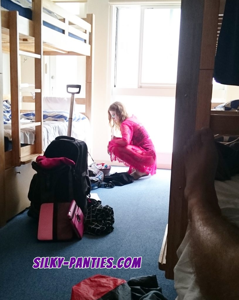 Teen girl unpacks in hostel